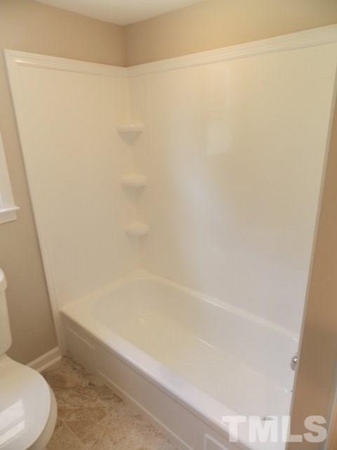 5624 Pelham Road Durham, NC 27713 - Photo 8 of 15 a bathroom with a shower and a toilet