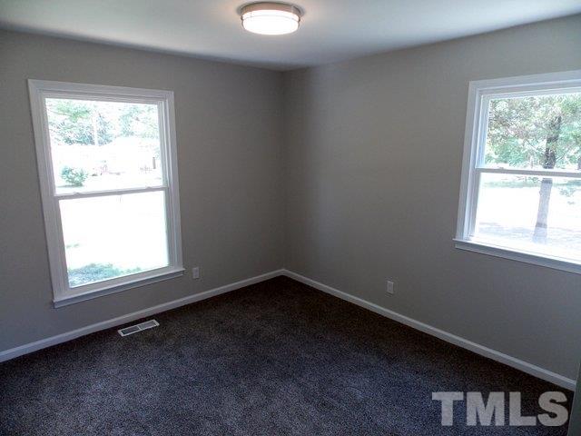 5624 Pelham Road Durham, NC 27713 - Photo 9 of 15 an empty room with a window