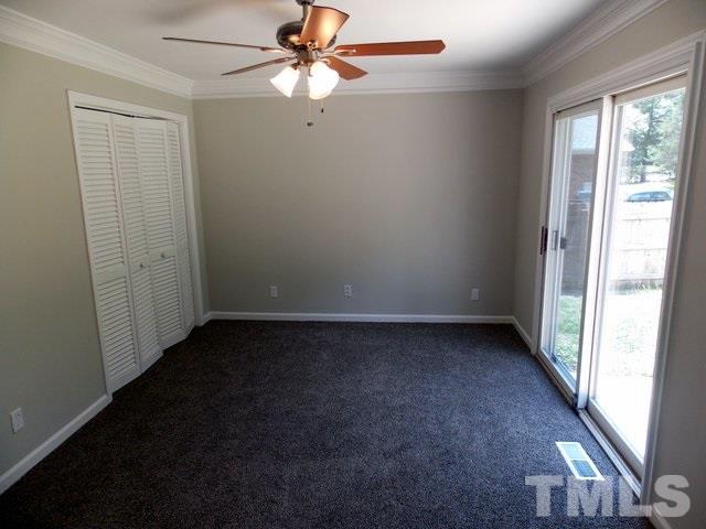 5624 Pelham Road Durham, NC 27713 - Photo 10 of 15 an empty room with windows and fan