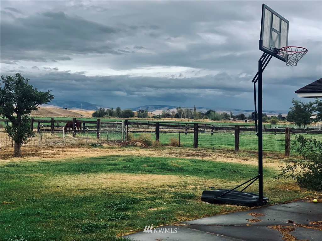 743 Locher Road Touchet, WA 99360 - Photo 18 of 33 a view of a big yard next to a fountain
