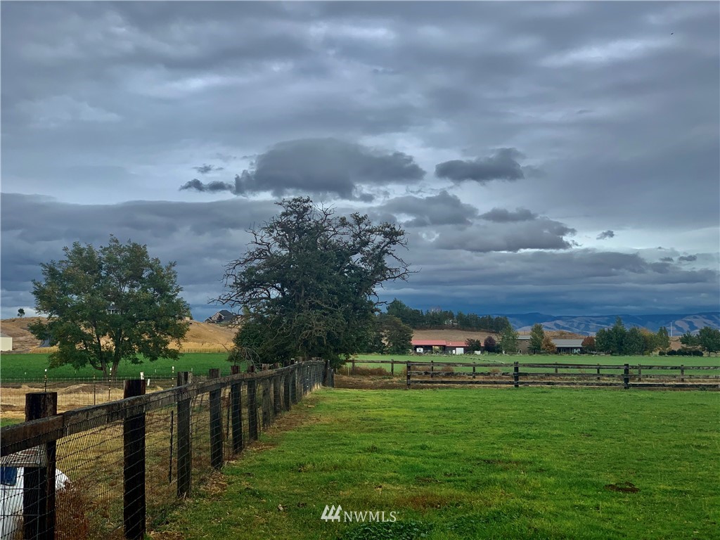 743 Locher Road Touchet, WA 99360 - Photo 27 of 33 a view of a green field with wooden fence