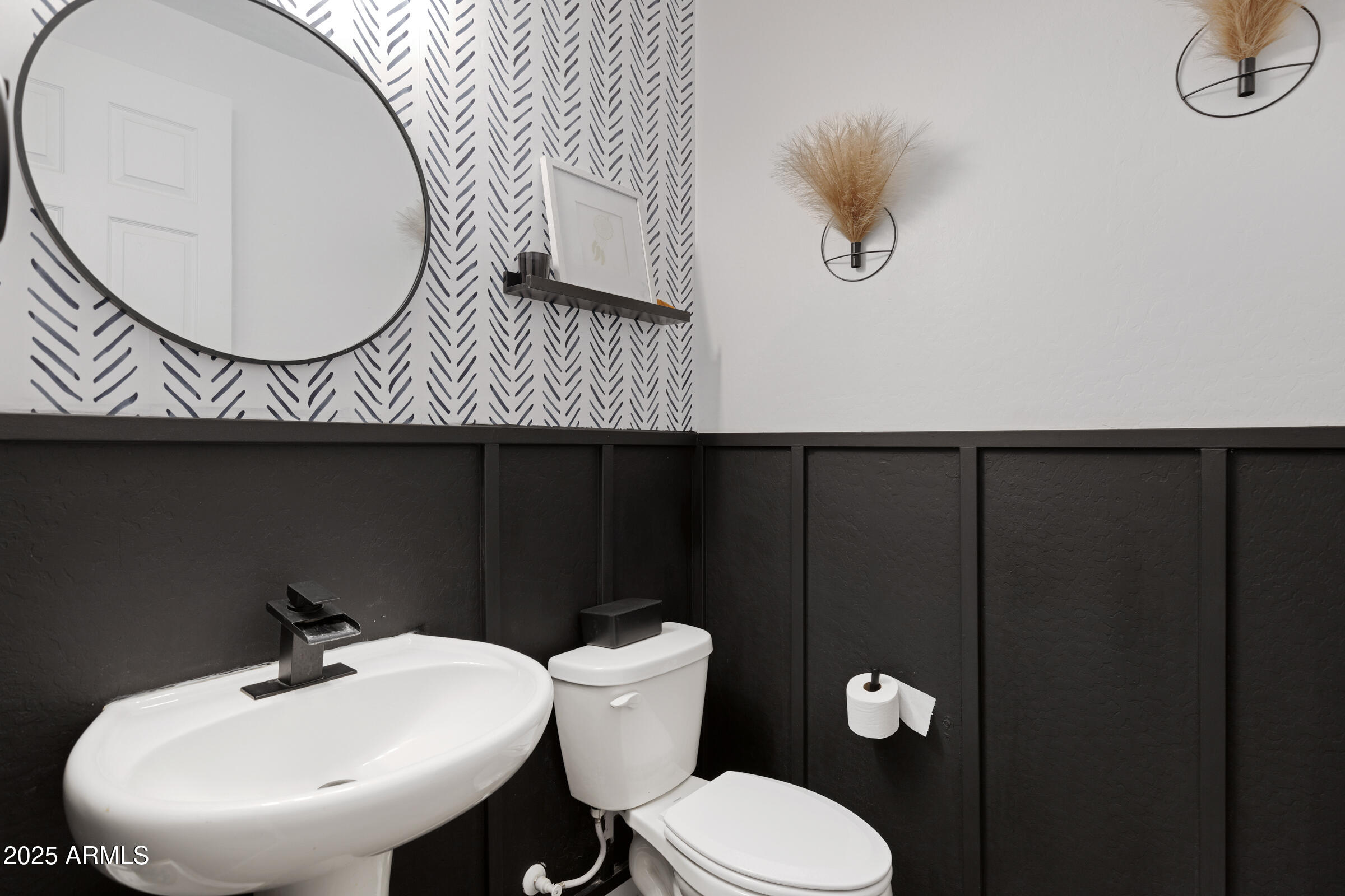 24450 Seed Road Florence, AZ 85132 - Photo 12 of 39 a bathroom with a toilet a sink and mirror