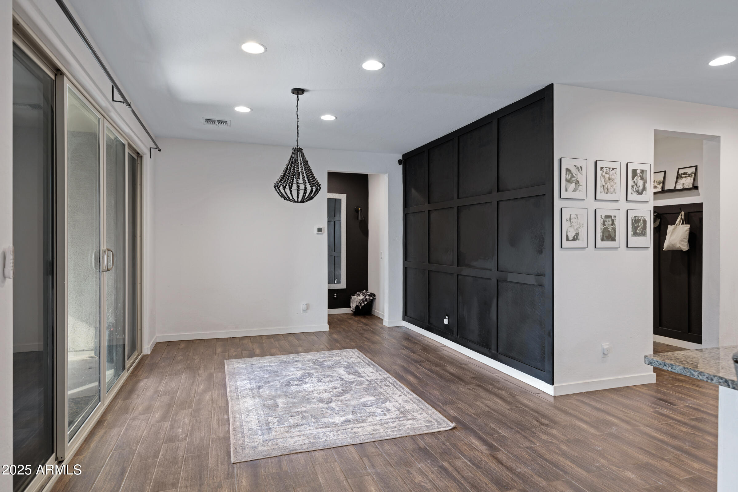 24450 Seed Road Florence, AZ 85132 - Photo 21 of 39 a view of an empty room with wooden floor and a window