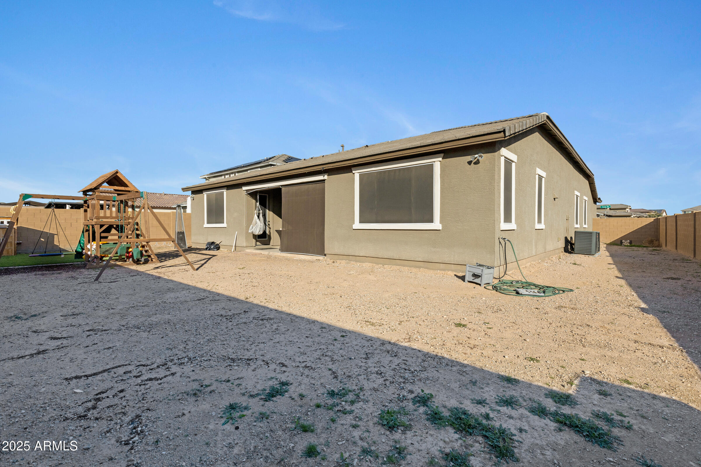 24450 Seed Road Florence, AZ 85132 - Photo 35 of 39 a front view of a house with a yard