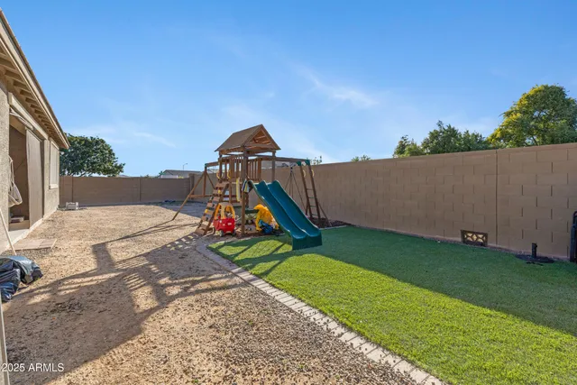 a bed sitting in a room next to a window
