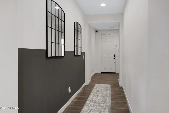 a view of a hallway with windows