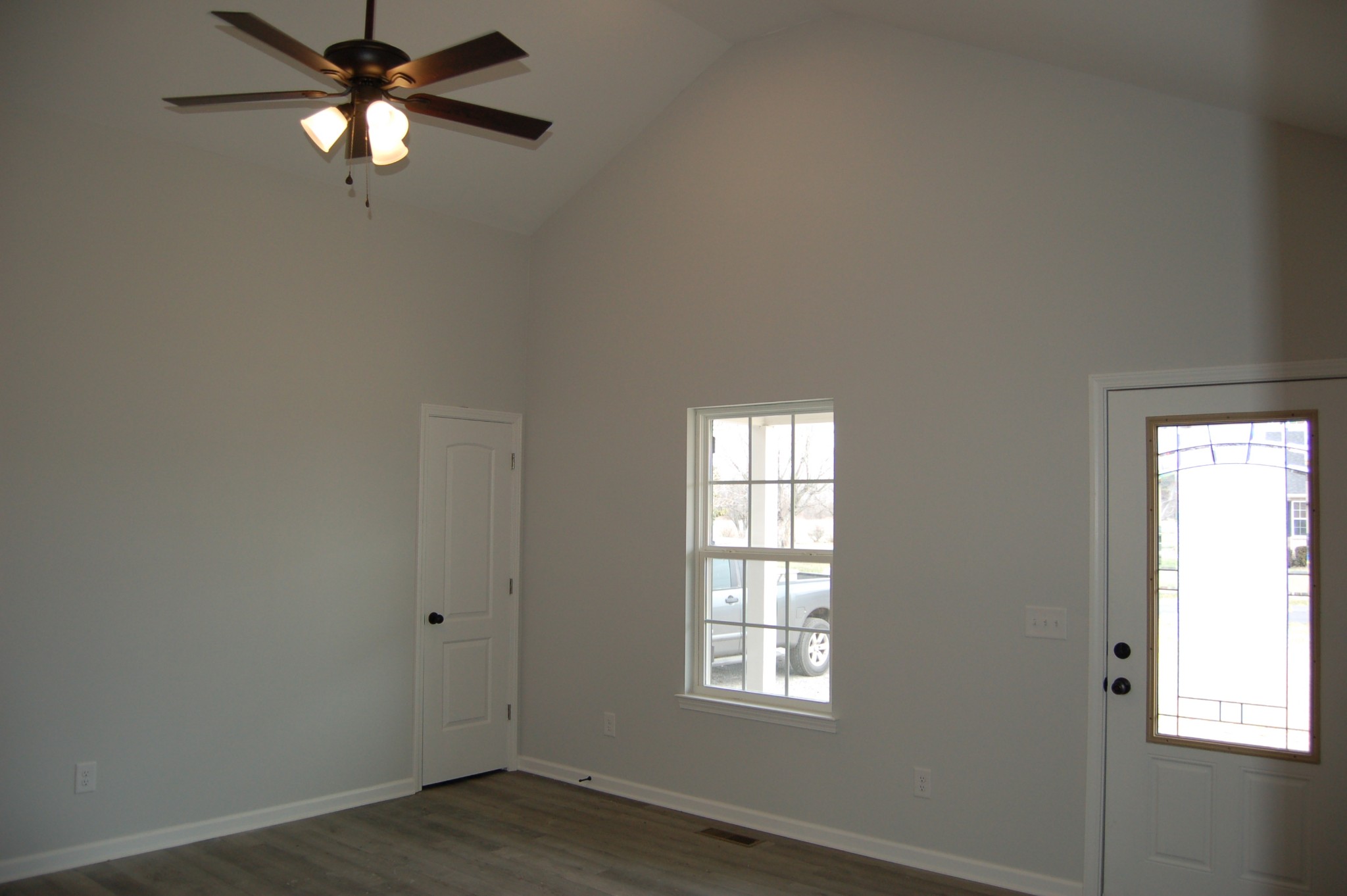 183 Scattersville Road Portland, TN 37148 - Photo 2 of 11 an empty room with windows and fan