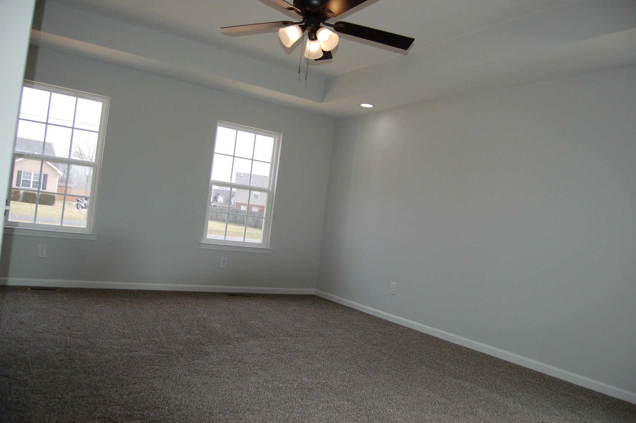 183 Scattersville Road Portland, TN 37148 - Photo 7 of 11 en empty room with windows and ceiling fan