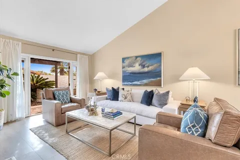 a living room with furniture and a lamp