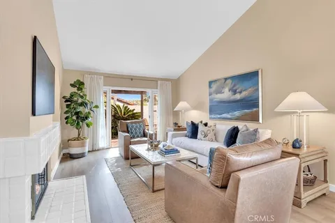 a living room with furniture and a lamp