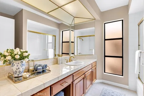 a view of a house with swimming pool and sitting area