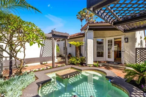 an aerial view of a houses with yard