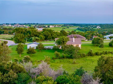 a view of a house with a big yard