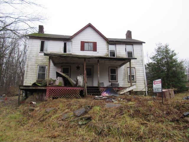 1047 Cinder Road Dunbar, PA 15431 - Photo 1 of 20 a front view of a house with a yard