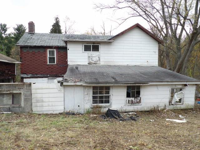 1047 Cinder Road Dunbar, PA 15431 - Photo 12 of 20 a front view of a house with a garden