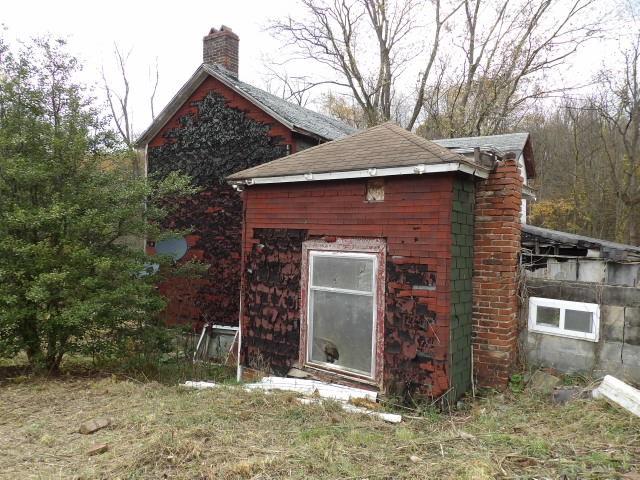 1047 Cinder Road Dunbar, PA 15431 - Photo 16 of 20 a front view of a house with a yard