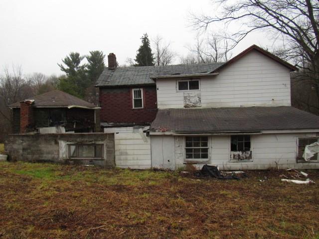 1047 Cinder Road Dunbar, PA 15431 - Photo 4 of 20 a front view of a house with a yard