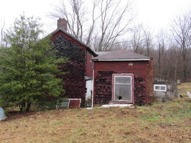 1047 Cinder Road Dunbar, PA 15431 - Photo 5 of 20 a front view of a house with yard and trees