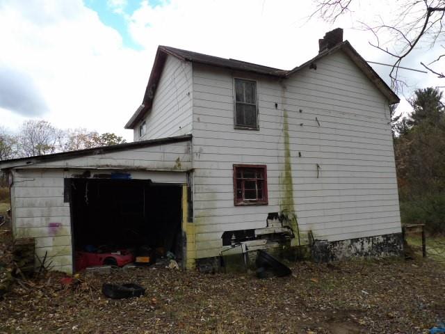1047 Cinder Road Dunbar, PA 15431 - Photo 9 of 20 a front view of a house with a yard