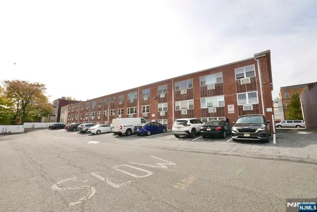 a view of street with parked cars