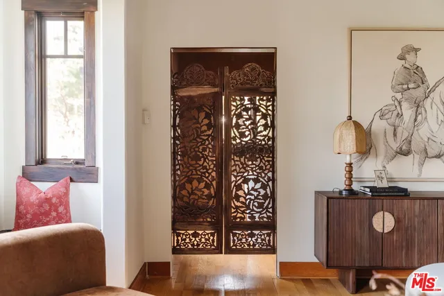 a view of a dining room with furniture large windows and wooden floor