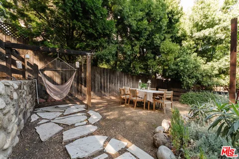 a large dining hall with a stove a sink and a refrigerator