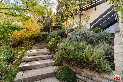 a view of a garden with pathway
