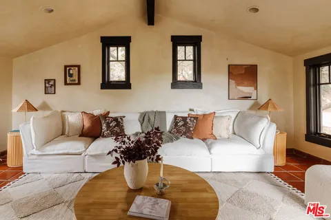 a bedroom with a bed and a table in it