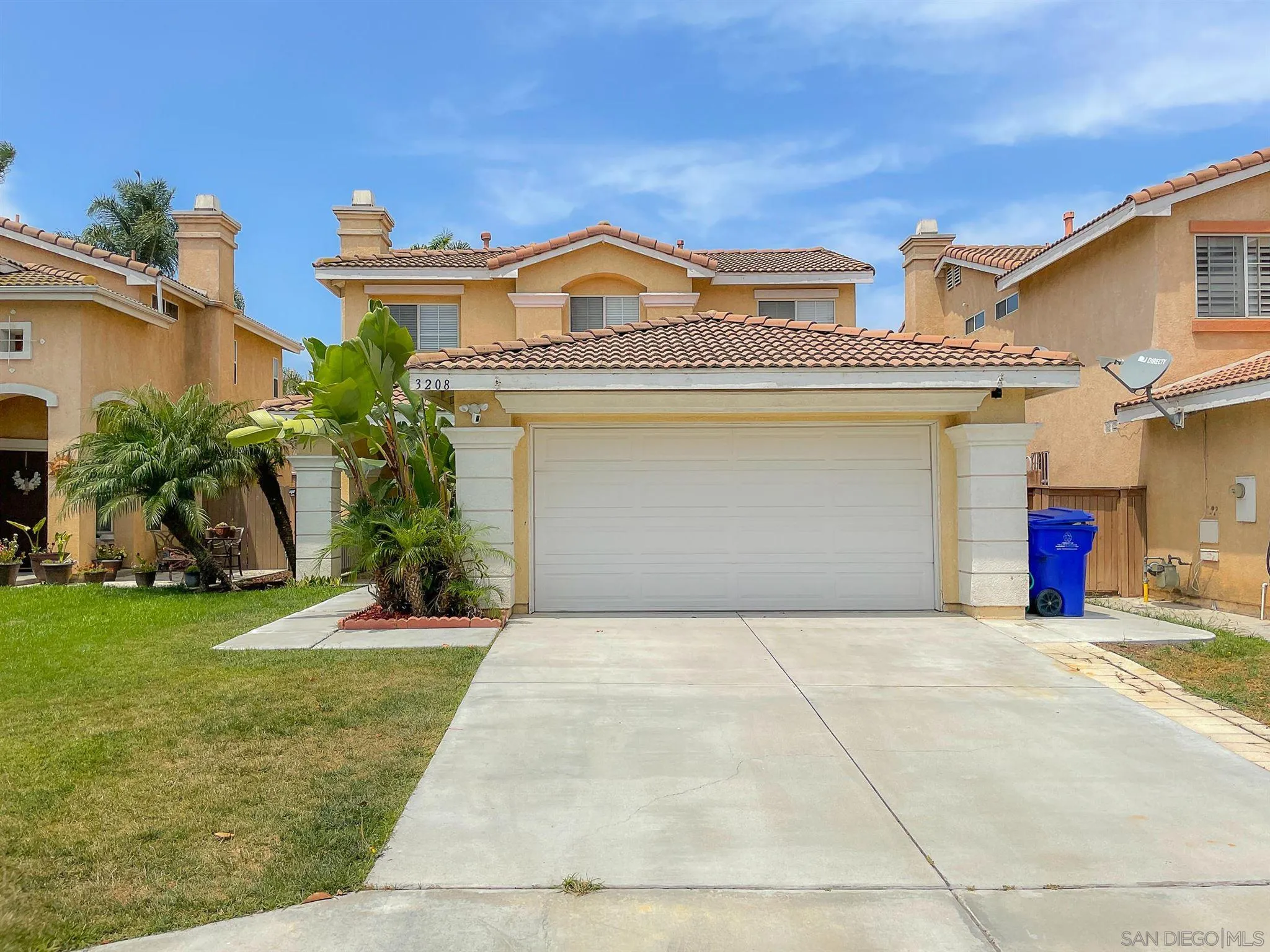 3208 Naylor Road San Diego, CA 92173 - Photo 1 of 24 a view of a house with a yard and potted plants
