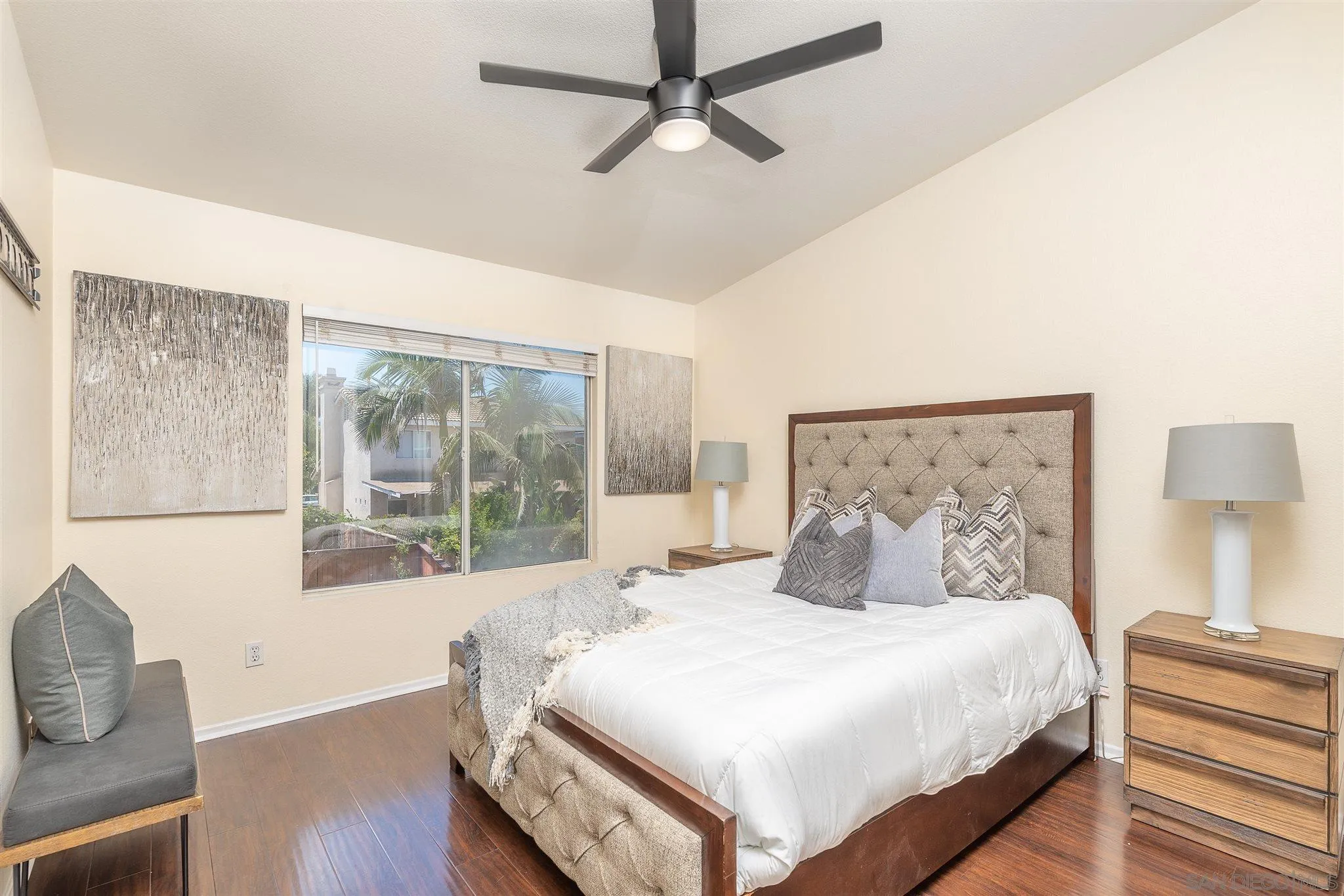 3208 Naylor Road San Diego, CA 92173 - Photo 13 of 24 a bedroom with a large bed and wooden floor