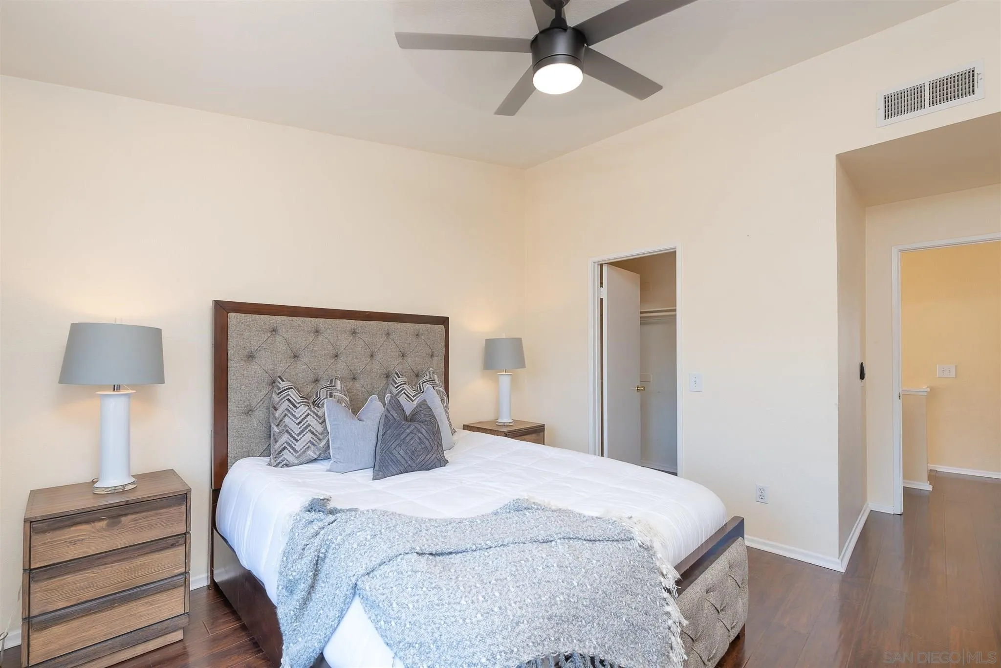 3208 Naylor Road San Diego, CA 92173 - Photo 15 of 24 a bedroom with a bed and a lamp