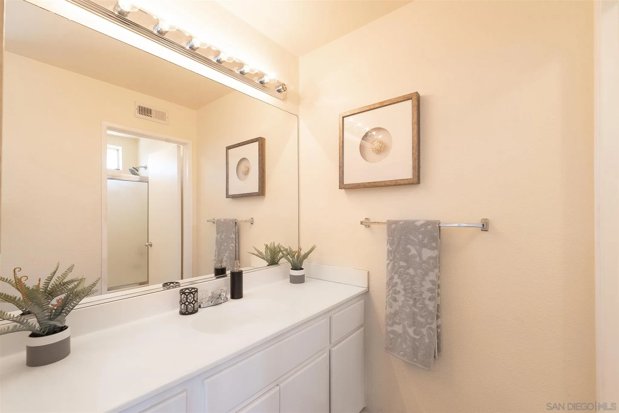 3208 Naylor Road San Diego, CA 92173 - Photo 16 of 24 a bathroom with a sink and a mirror