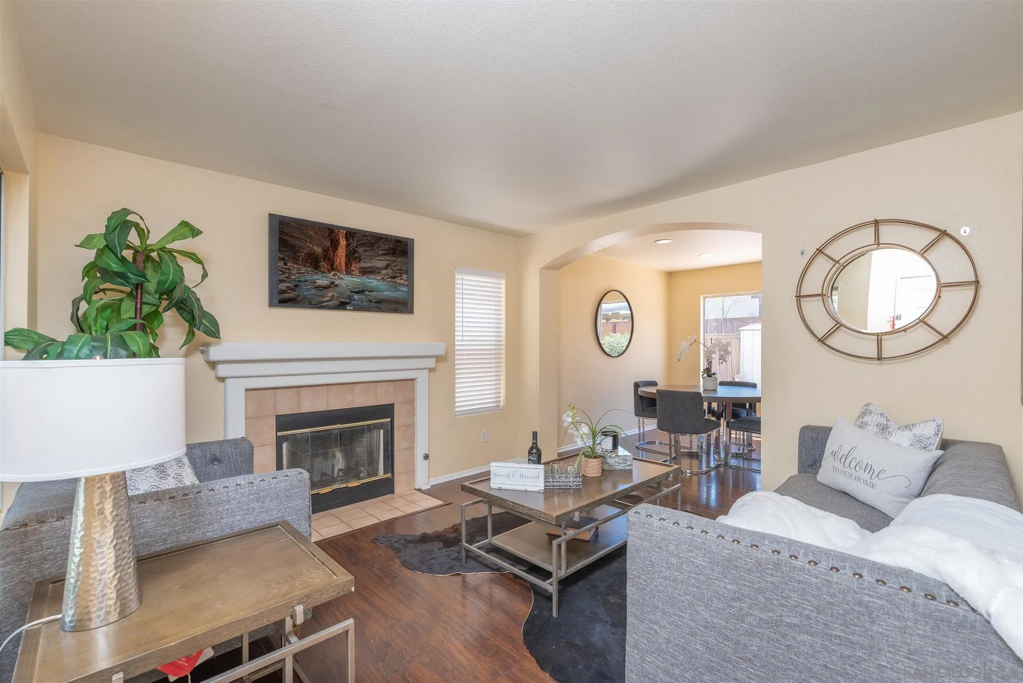 3208 Naylor Road San Diego, CA 92173 - Photo 4 of 24 a living room with furniture a fireplace and a potted plant