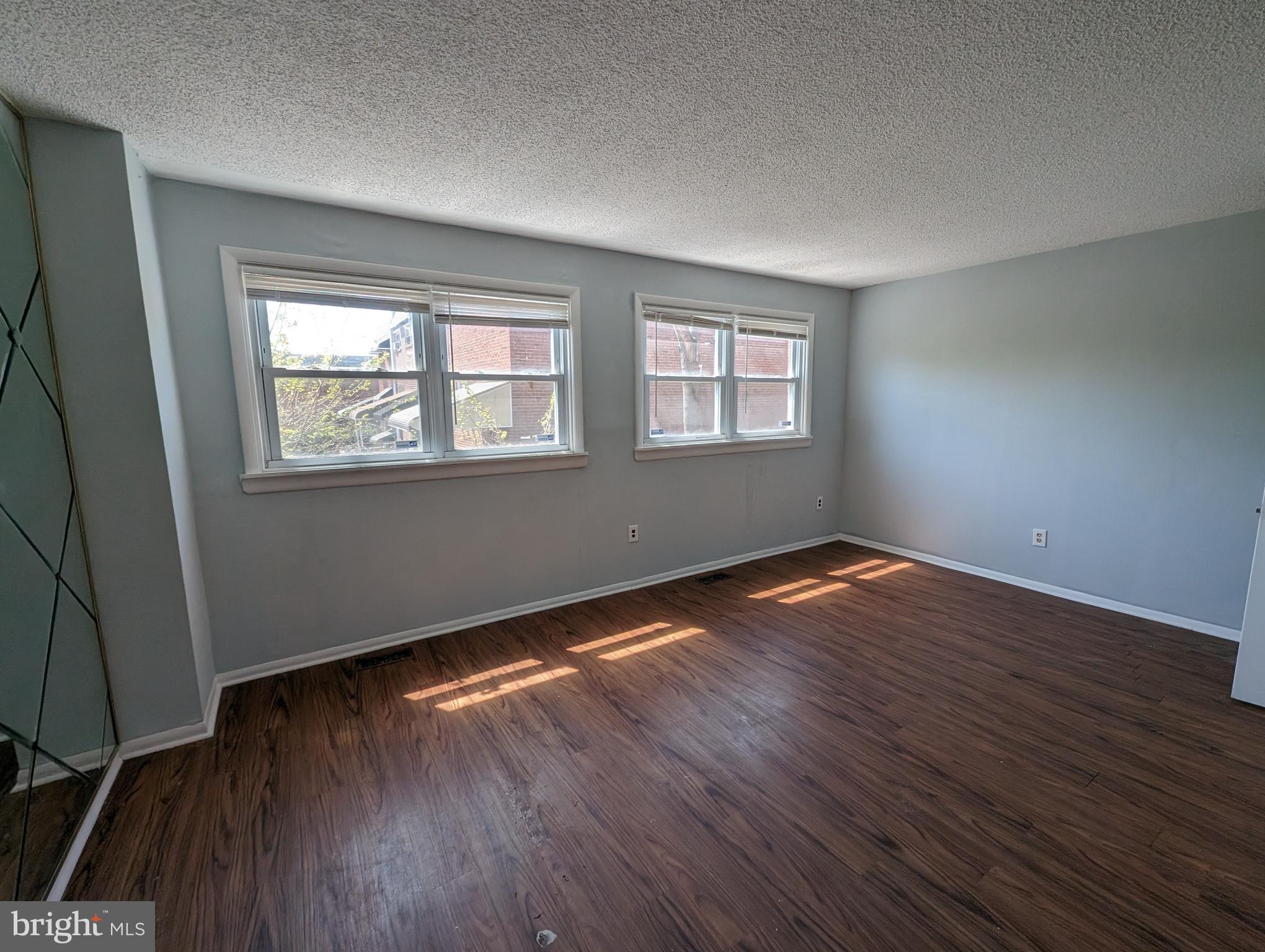 1104 Master Street Philadelphia, PA 19122 - Photo 12 of 22 a view of an empty room with wooden floor and a window