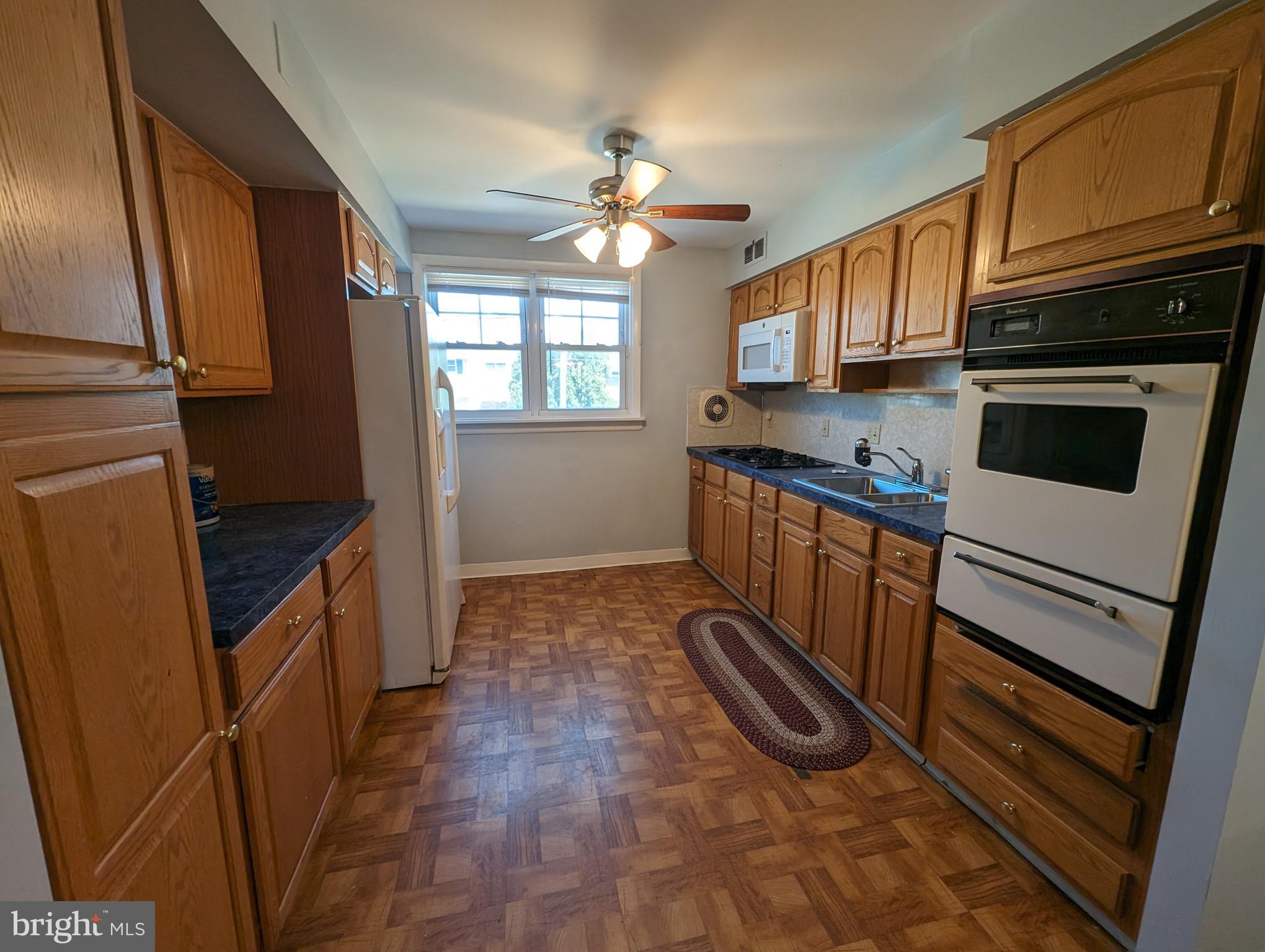 1104 Master Street Philadelphia, PA 19122 - Photo 14 of 22 a kitchen with stainless steel appliances granite countertop a refrigerator a stove a sink and dishwasher