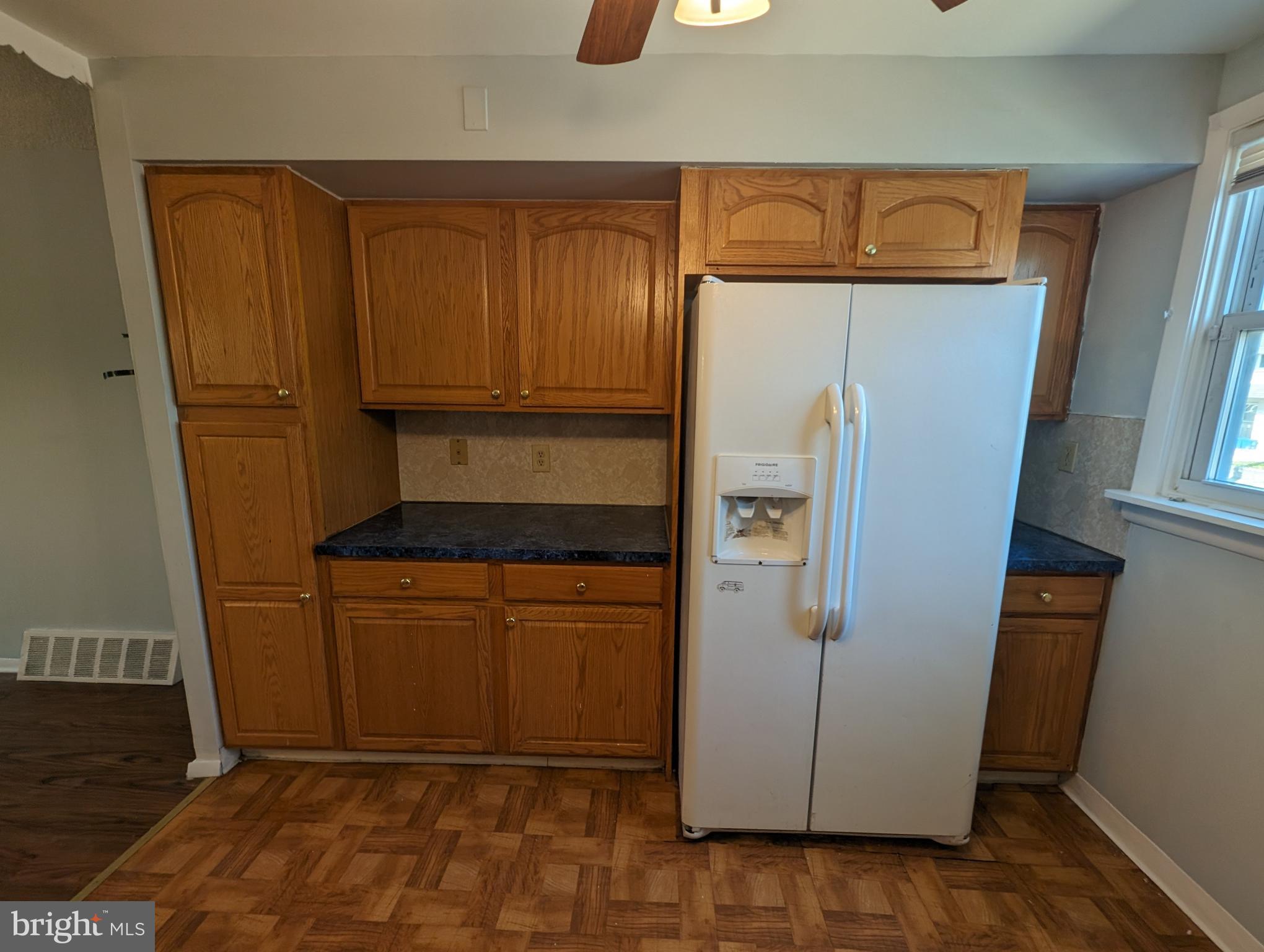 1104 Master Street Philadelphia, PA 19122 - Photo 16 of 22 a kitchen with a refrigerator and cabinets