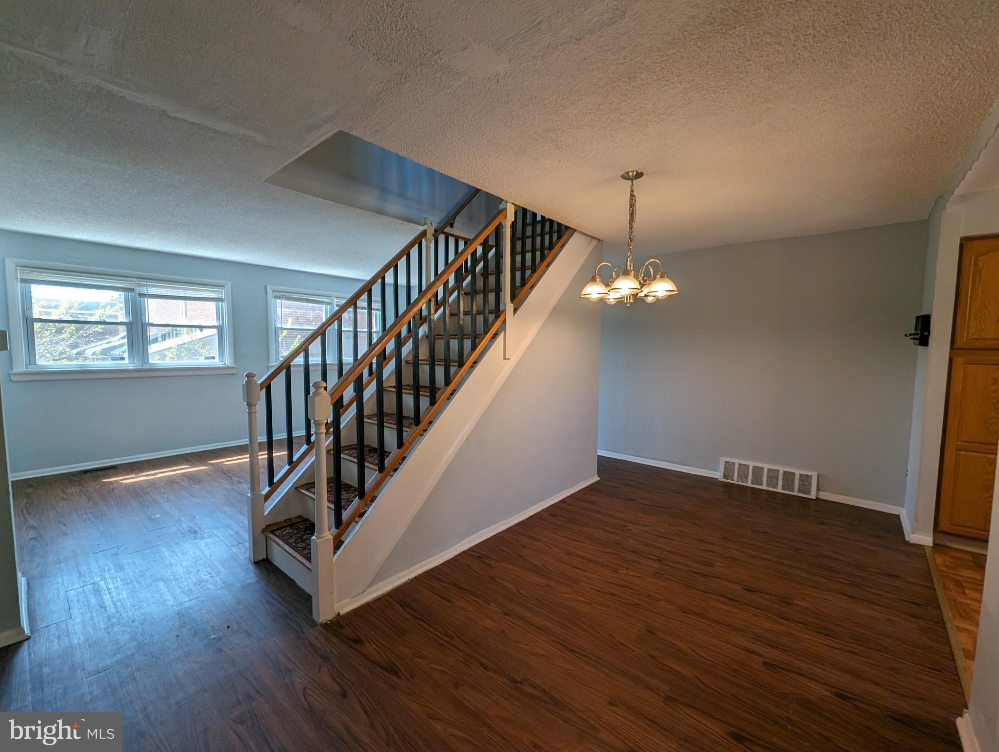 1104 Master Street Philadelphia, PA 19122 - Photo 17 of 22 a view of an empty room with wooden floor and stairs