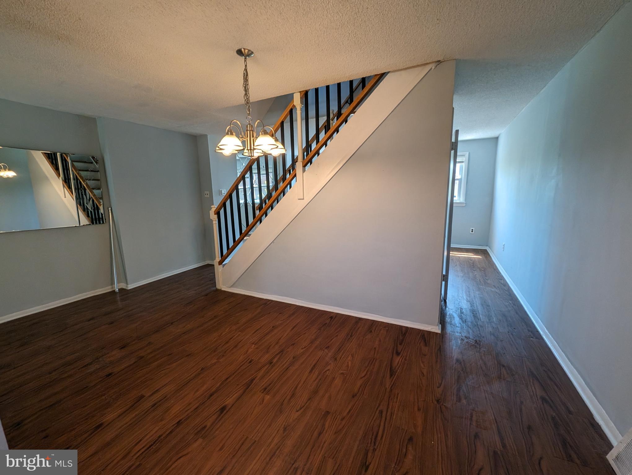 1104 Master Street Philadelphia, PA 19122 - Photo 19 of 22 a view of a hallway with wooden floor and stairs