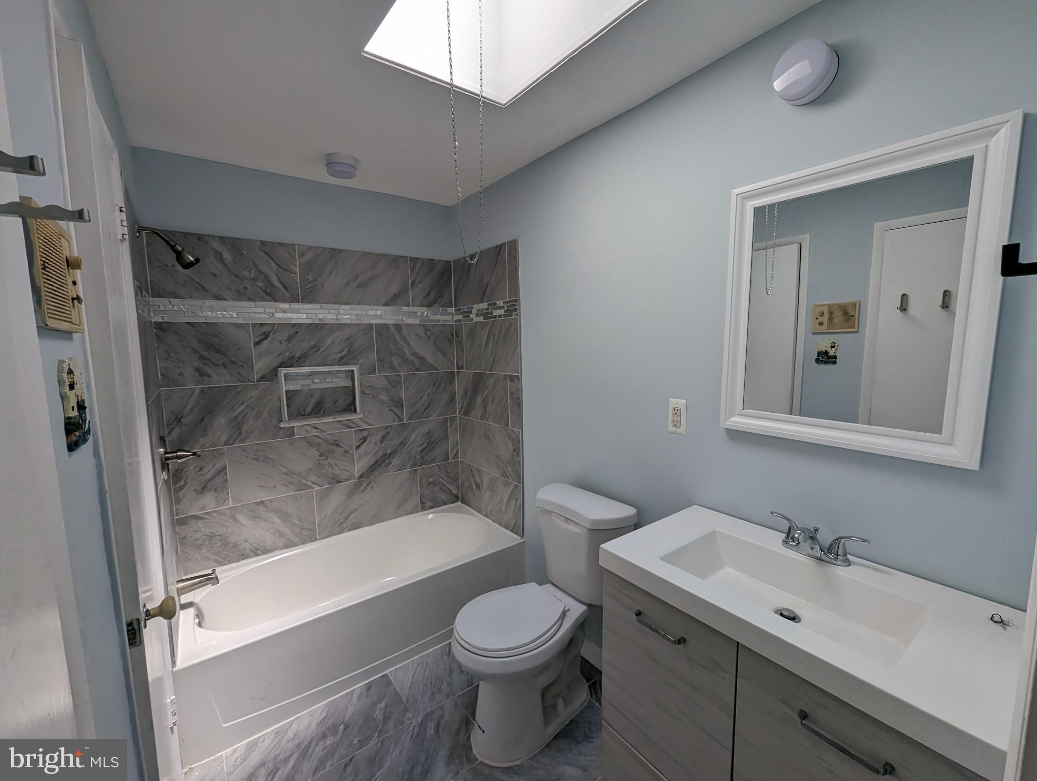 1104 Master Street Philadelphia, PA 19122 - Photo 5 of 22 a bathroom with a sink toilet and shower