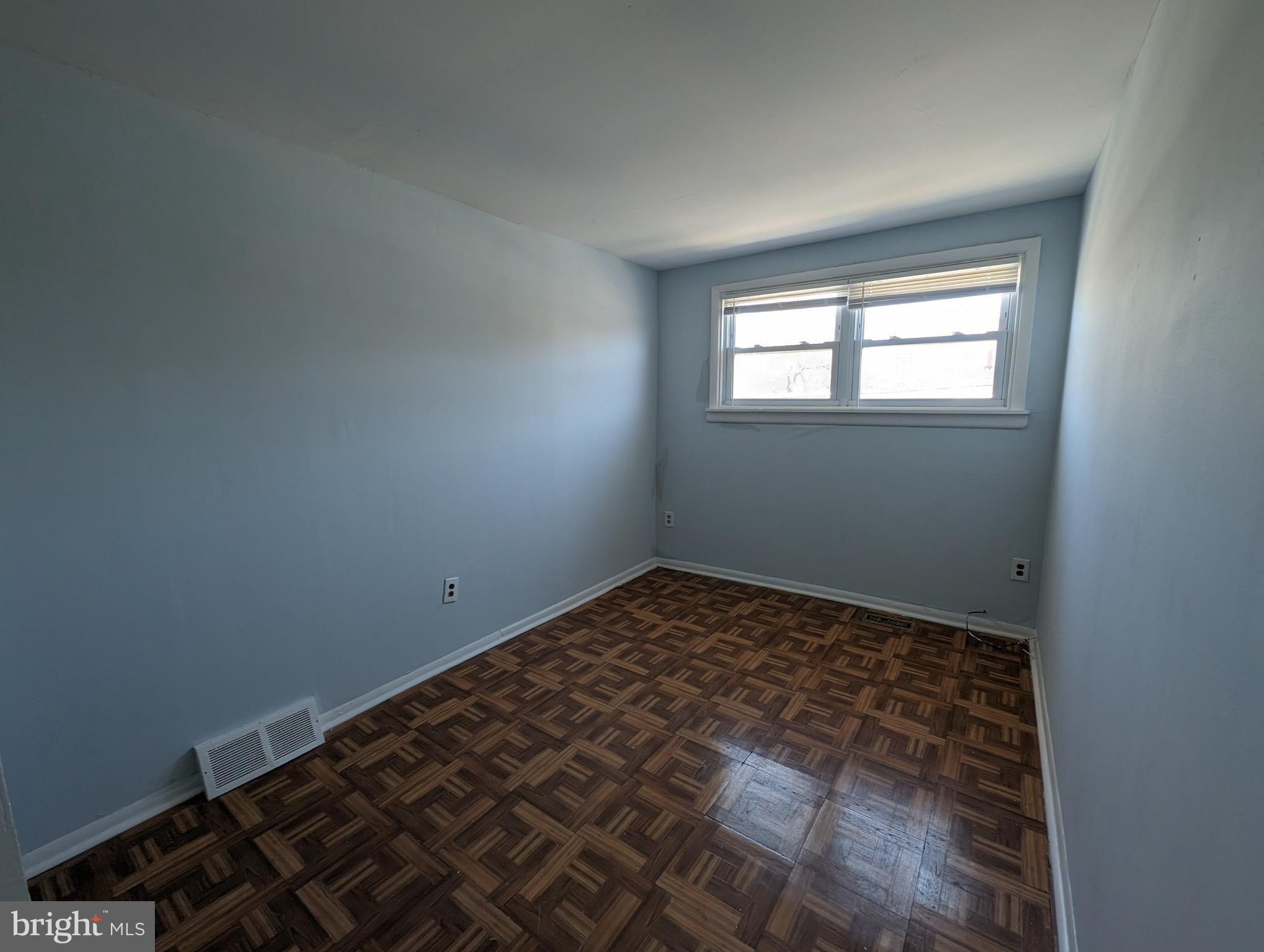 1104 Master Street Philadelphia, PA 19122 - Photo 6 of 22 a view of a room with wooden floor and a window