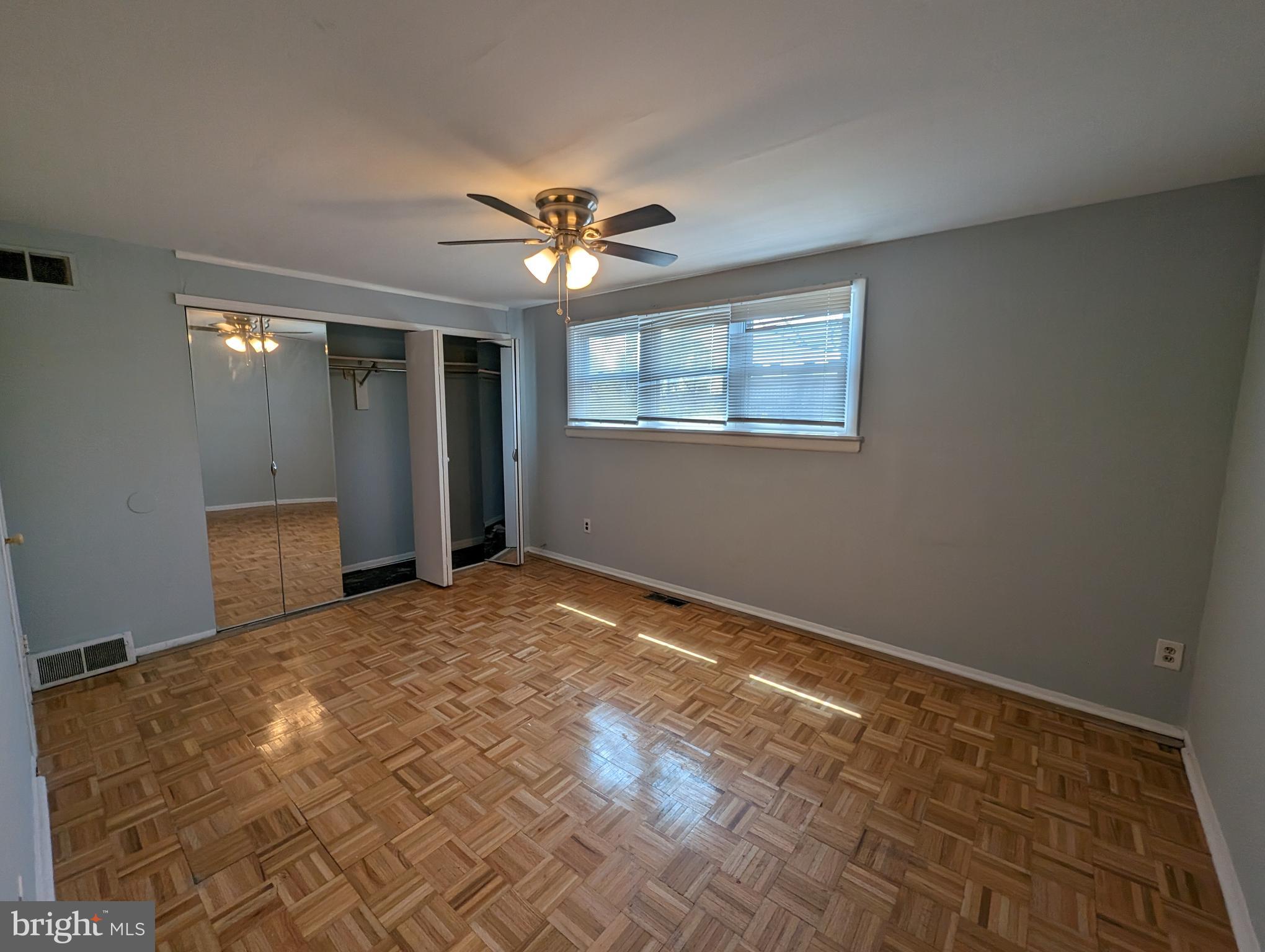 1104 Master Street Philadelphia, PA 19122 - Photo 10 of 22 a view of a big room with windows and chandelier fan