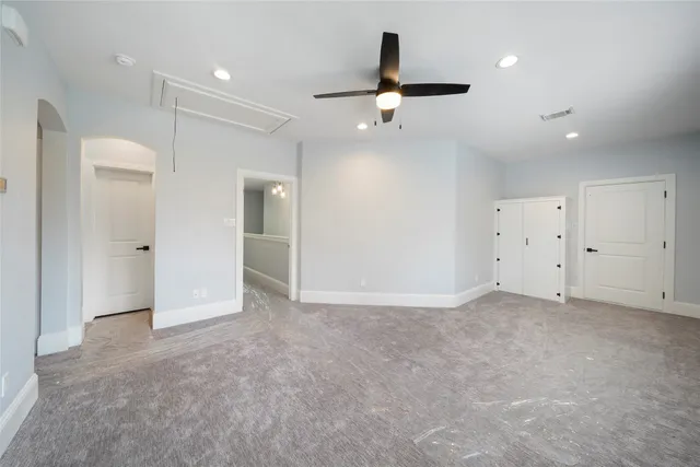 a bathroom with a granite countertop sink mirror vanity and toilet