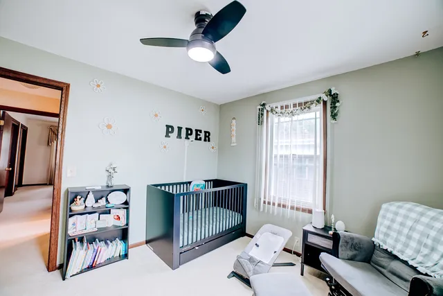 a bedroom with furniture and a window