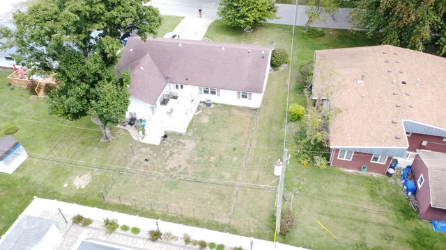 an aerial view of house with yard