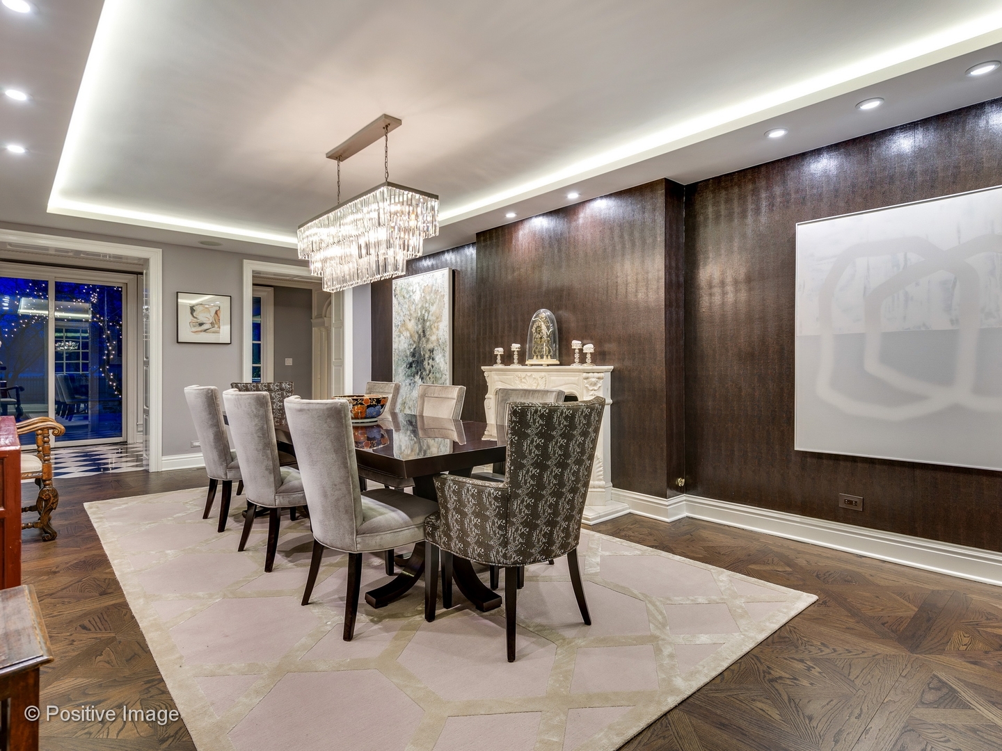 32 Indian Hill Road Winnetka, IL 60093 - Photo 11 of 79 a dining room with a wooden table and chairs