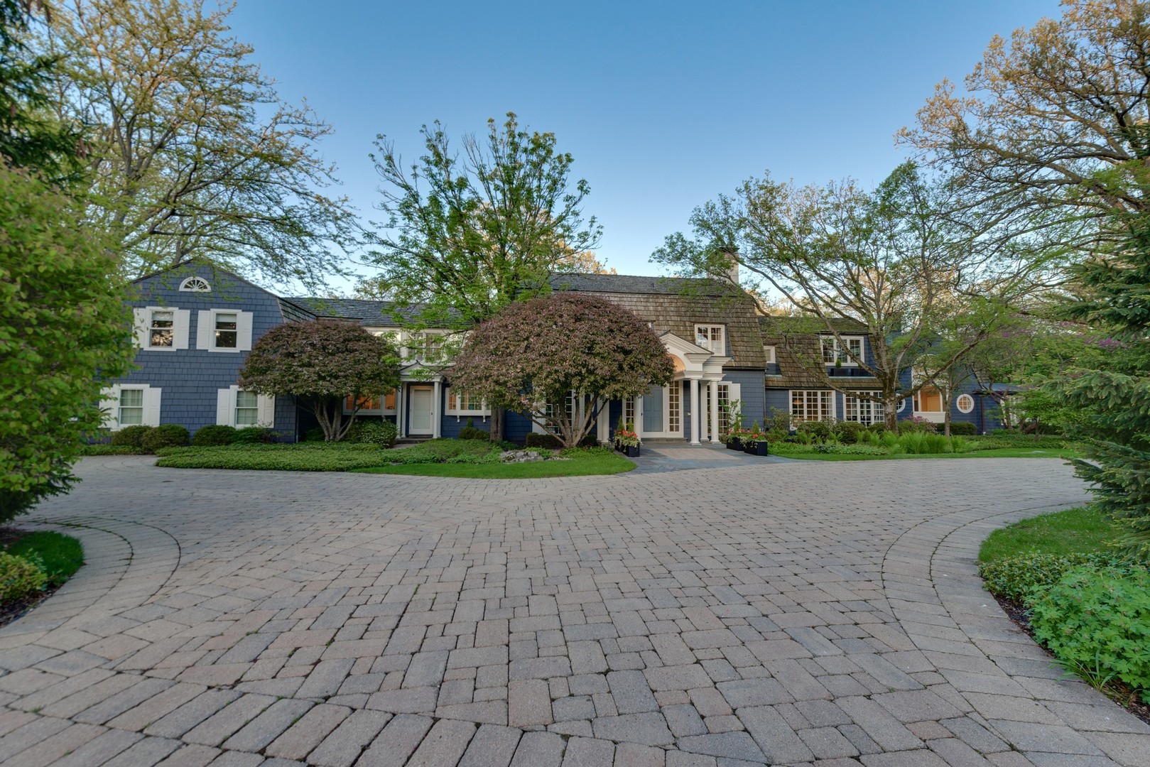 32 Indian Hill Road Winnetka, IL 60093 - Photo 3 of 79 a view of a brick house with a yard and large tree