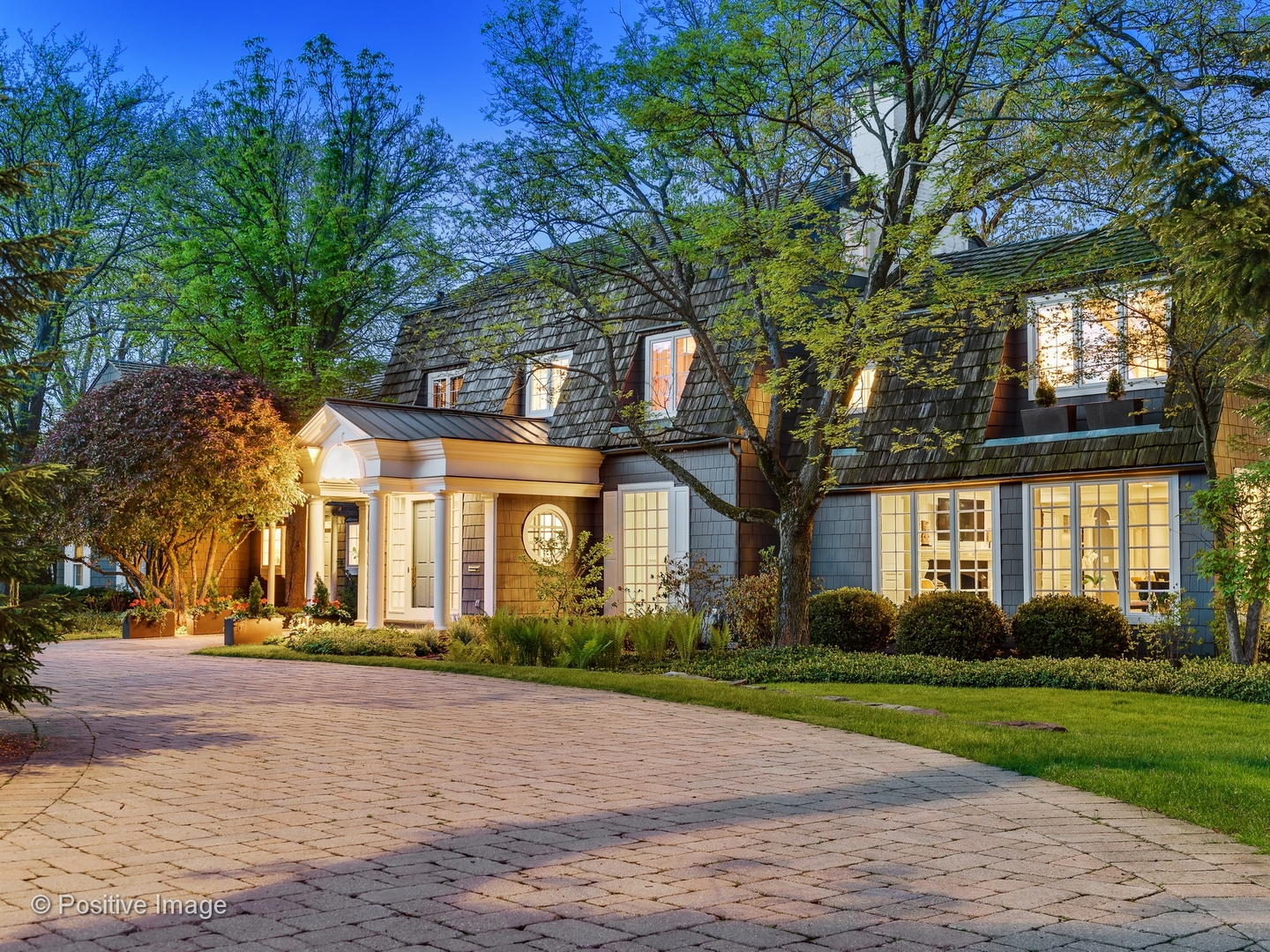 32 Indian Hill Road Winnetka, IL 60093 - Photo 56 of 79 a front view of a house with a garden