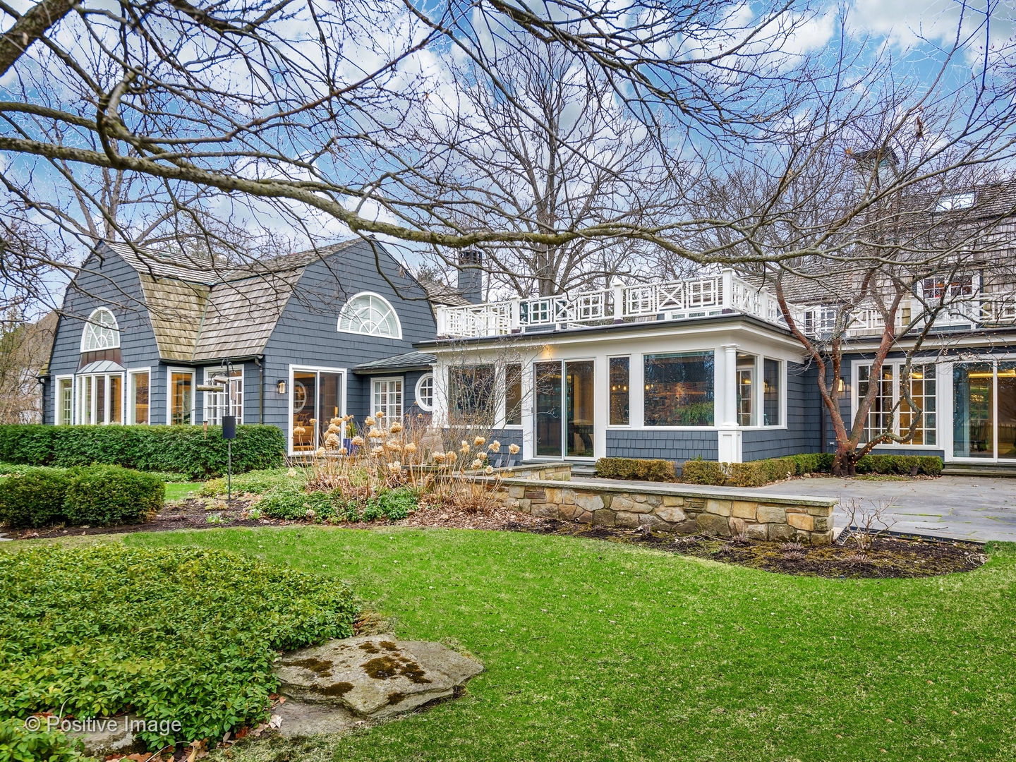 32 Indian Hill Road Winnetka, IL 60093 - Photo 71 of 79 a front view of a house with a garden
