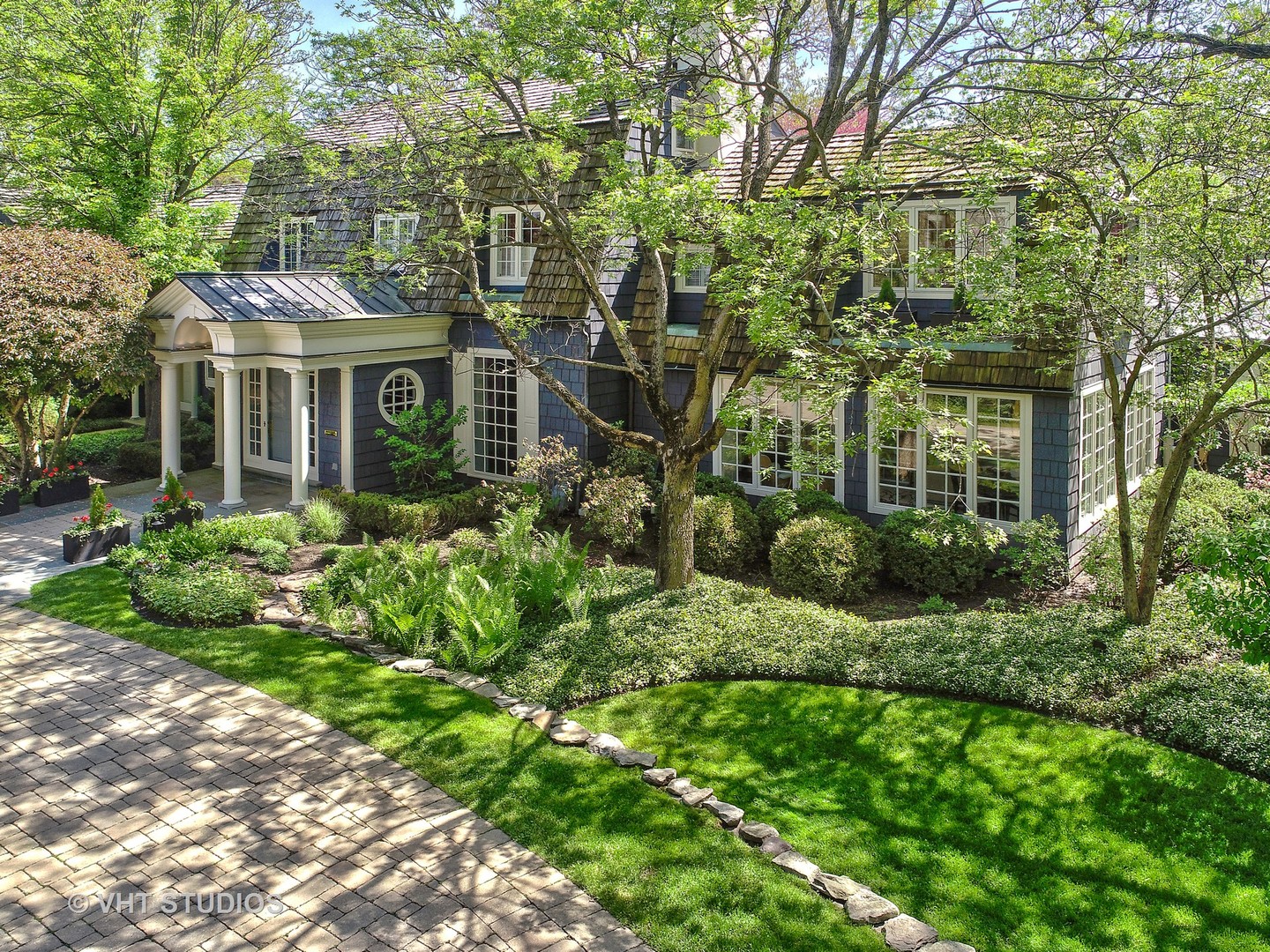 32 Indian Hill Road Winnetka, IL 60093 - Photo 77 of 79 a view of a big yard in front of a brick house