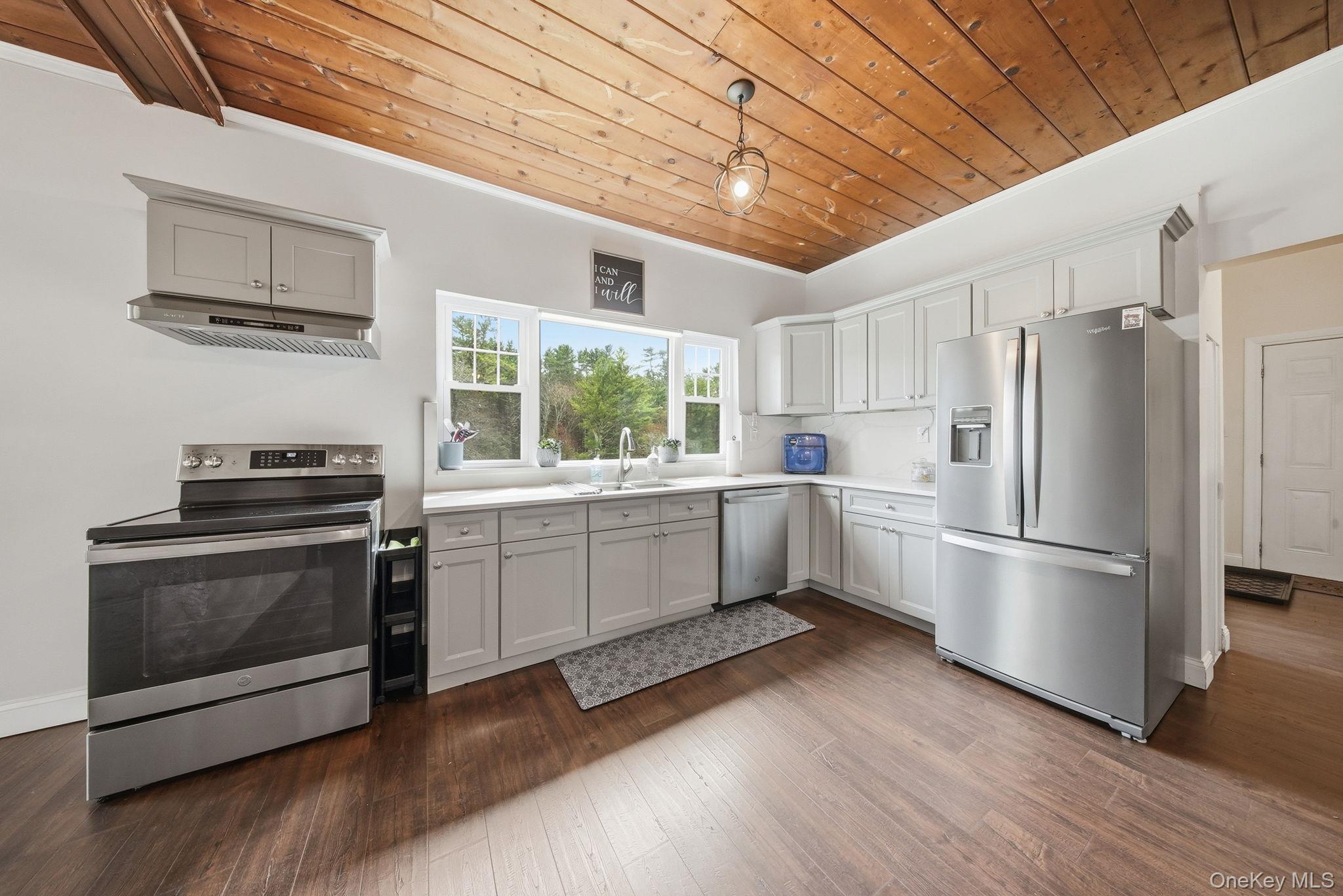 10 Stag Forest Road Forestburgh, NY 12777 - Photo 12 of 44 a kitchen with stainless steel appliances a stove a sink and a refrigerator
